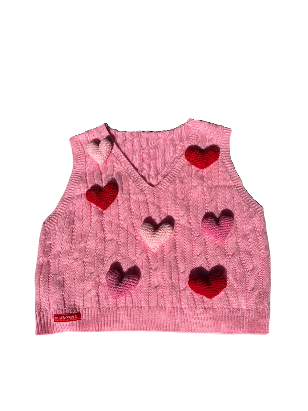 Pink vest adorned with 3D hearts in shades of pink and red.